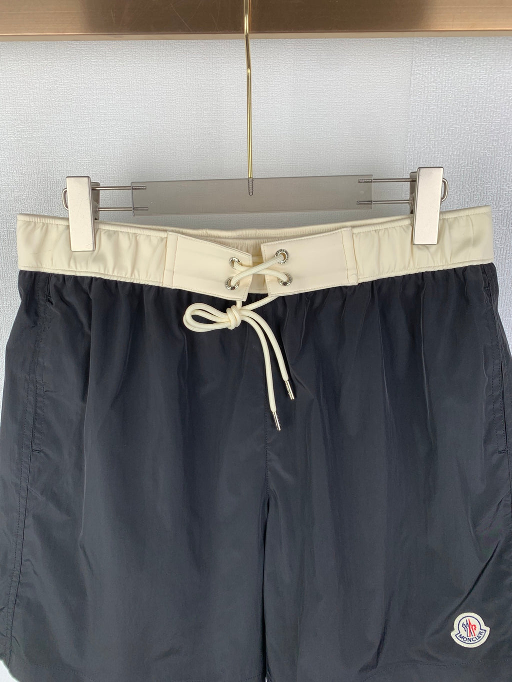 Moncler black swim shorts with cream waist band and tied drawstring
