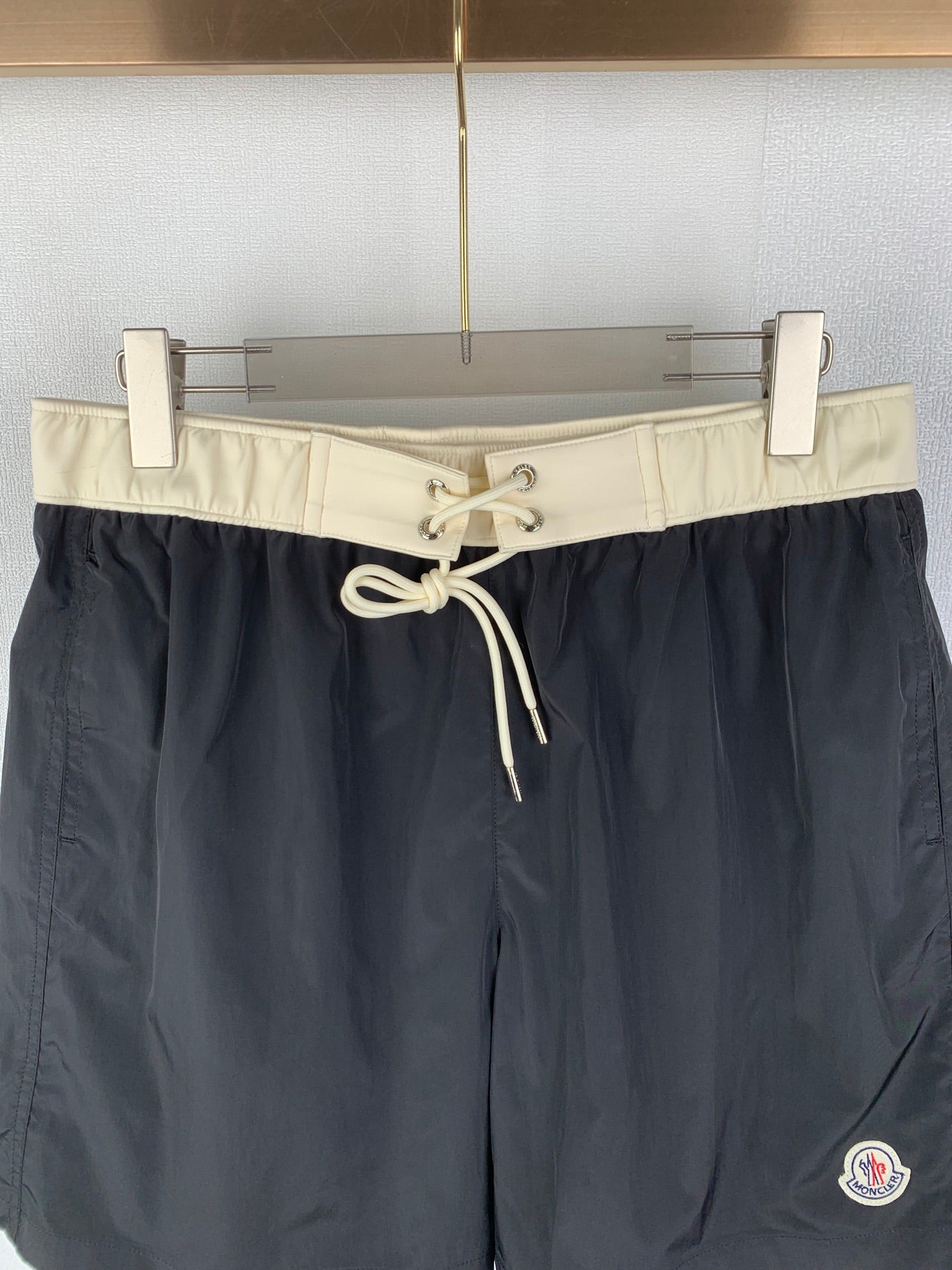 Moncler black swim shorts with cream waist band and tied drawstring