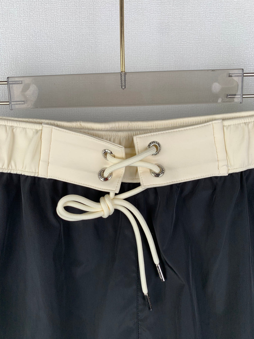 Moncler black swim shorts with cream drawstring cord and metal eyelets