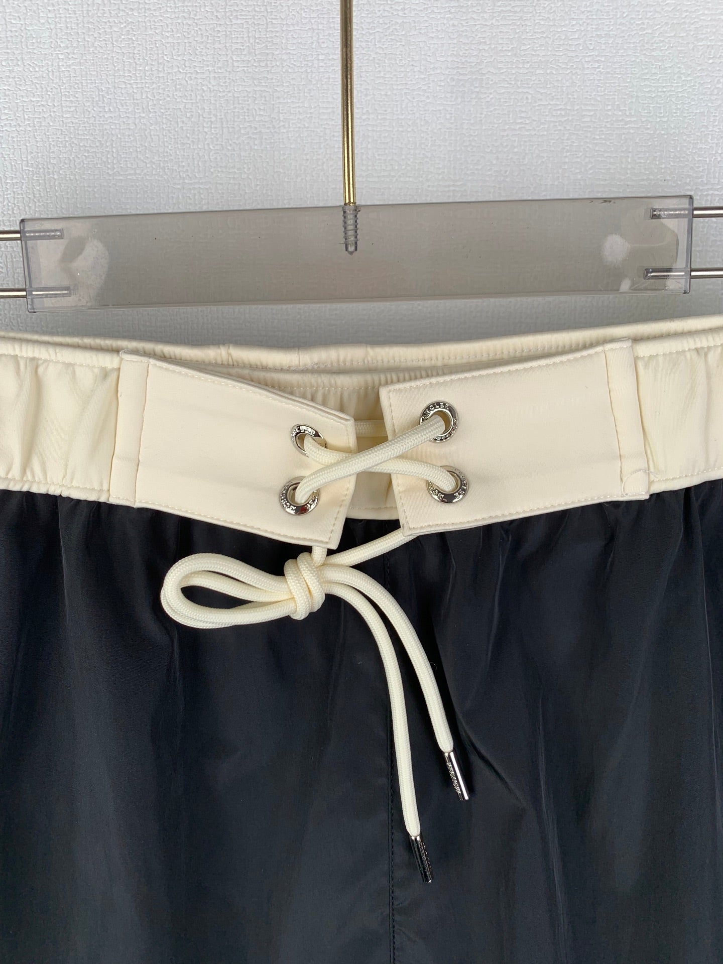Moncler black swim shorts with cream drawstring cord and metal eyelets