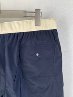 Moncler navy pants with flap side pocket and small round logo patch