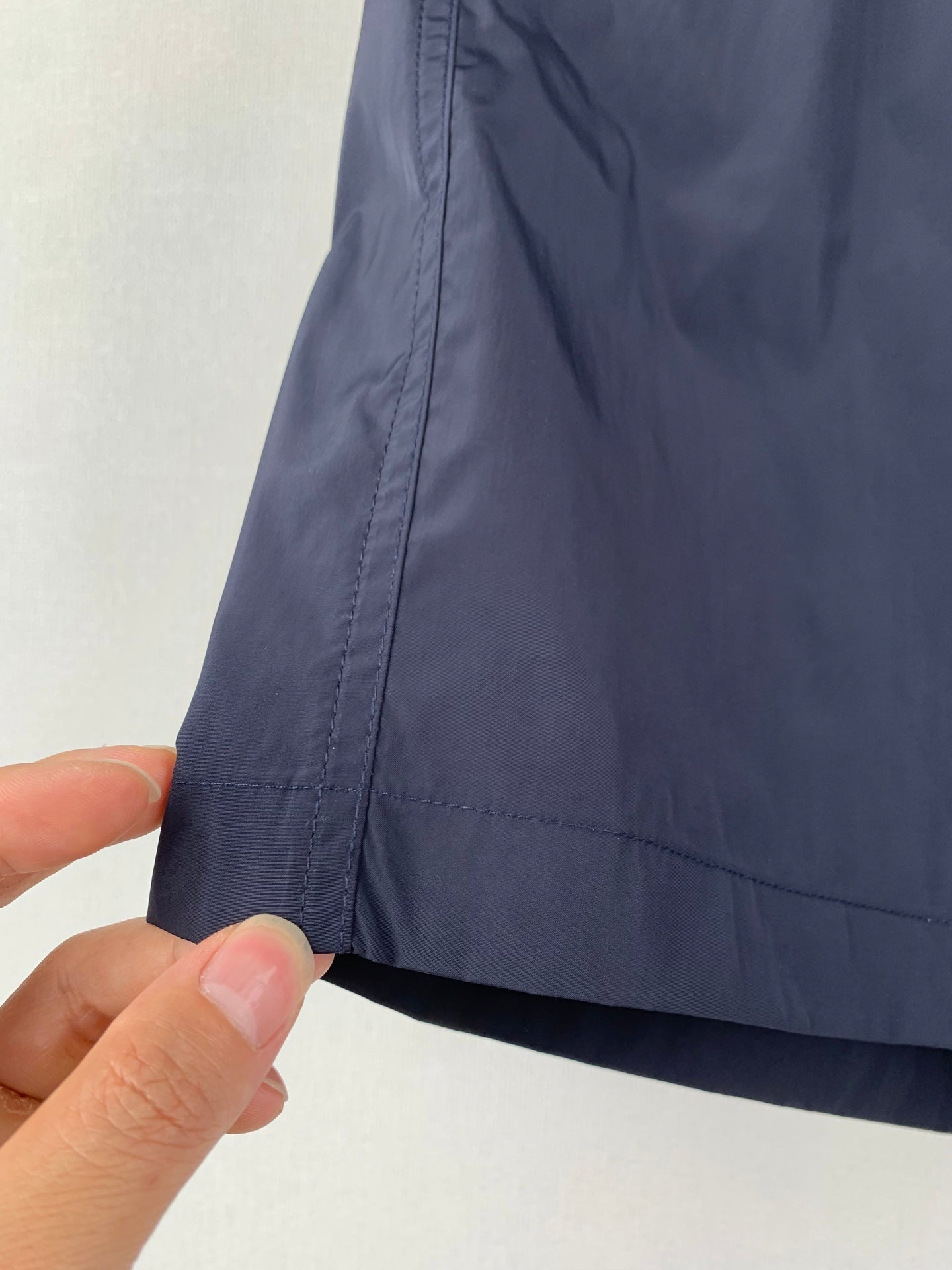 Dark blue pants with stitched seam and cuff hem detail