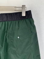 Moncler pants, green with dark waistband and front patch pocket, button detail