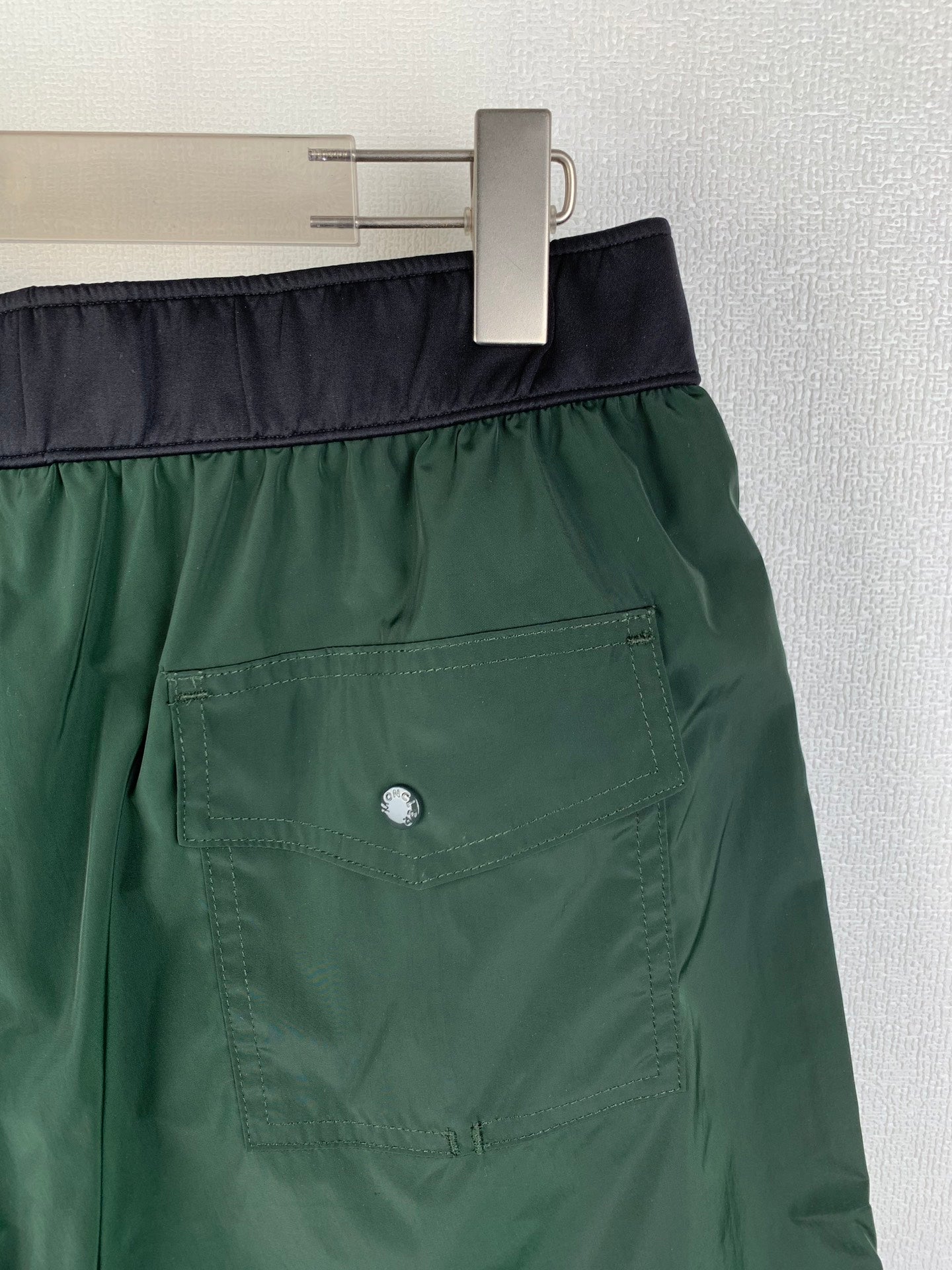 Moncler pants, green with dark waistband and front patch pocket, button detail
