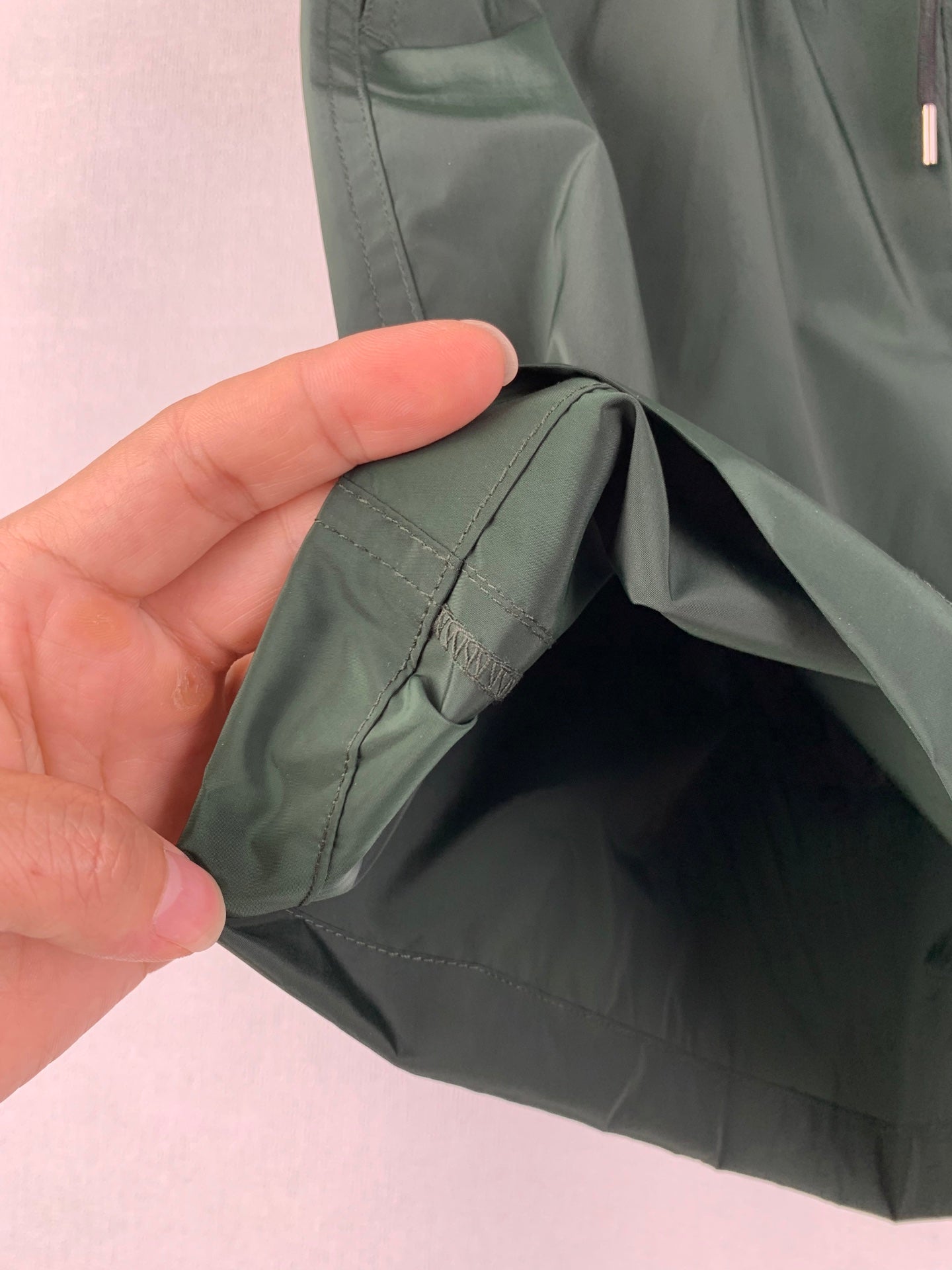 Moncler green shorts with interior pocket opening and seam stitching