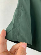 Moncler green shorts with side seam stitching and straight hem