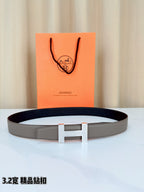 Hermes belt with gray leather strap and silver-tone H buckle, rectangular keeper