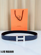 Blue leather belt with silver-tone H buckle and rectangular prong detail