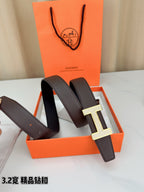 Dark brown leather belt with gold-tone H buckle shown at an angle