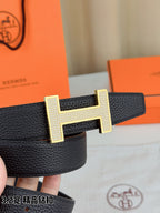 Hermes belt strap close-up with gold-tone H buckle and textured leather