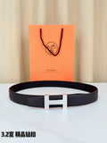 Hermes belt in dark textured leather with rectangular H buckle, silver-tone finish