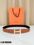 Tan leather belt with silver-tone H buckle and dark inner lining edge