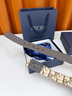 Dior belt with gray leather end, beige monogram strap, and CD buckle