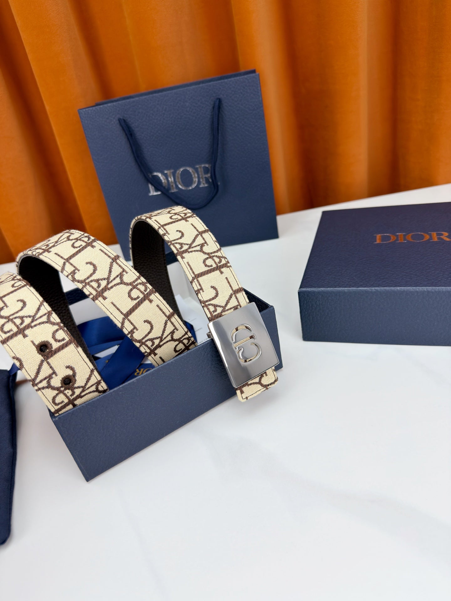 Dior monogram belt shown doubled, CD buckle on beige patterned strap