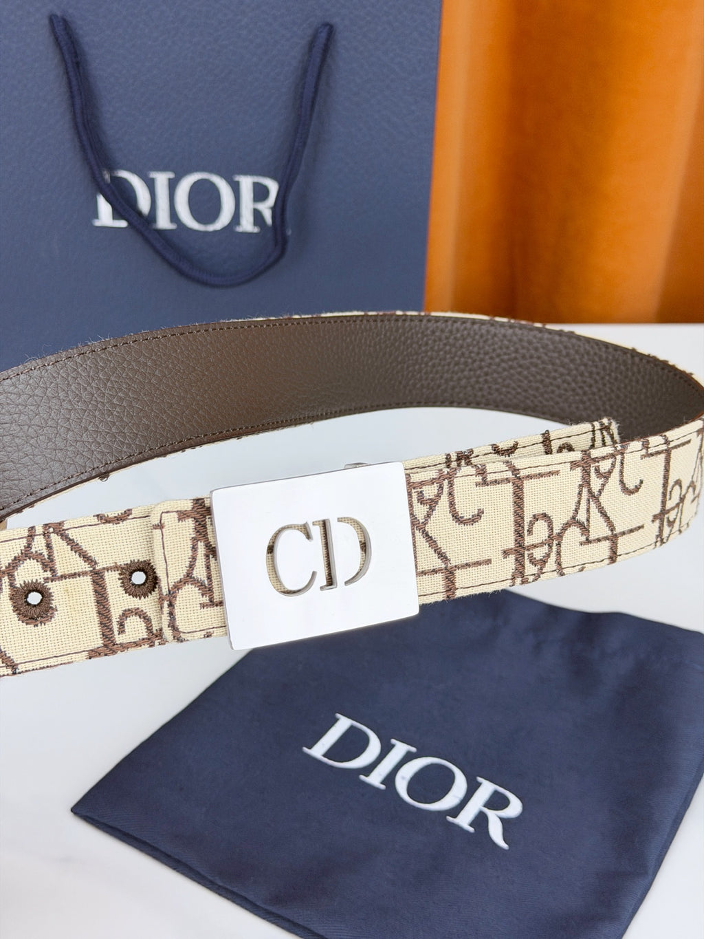 Dior monogram belt close-up, CD buckle on beige patterned strap