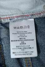 Denim care label: Gentle dry clean; protect before cleaning; iron inside before use.