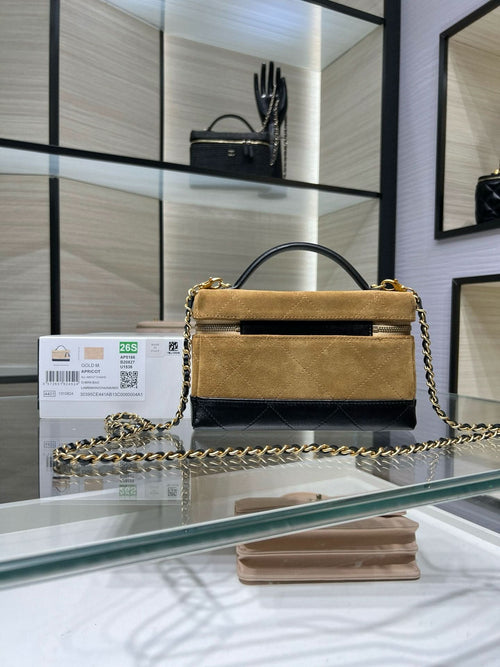 Gold Chanel top-handle bag with chain shoulder strap and rectangular flap front