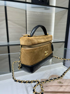 Gold and black Chanel top-handle shoulder bag with chain strap and gold-tone clasp