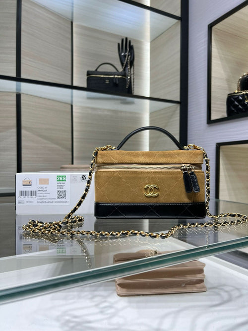 Gold suede-style Chanel flap handbag with chain strap and black leather trim