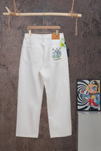 White denim pants with button fly and logo patch at right hip