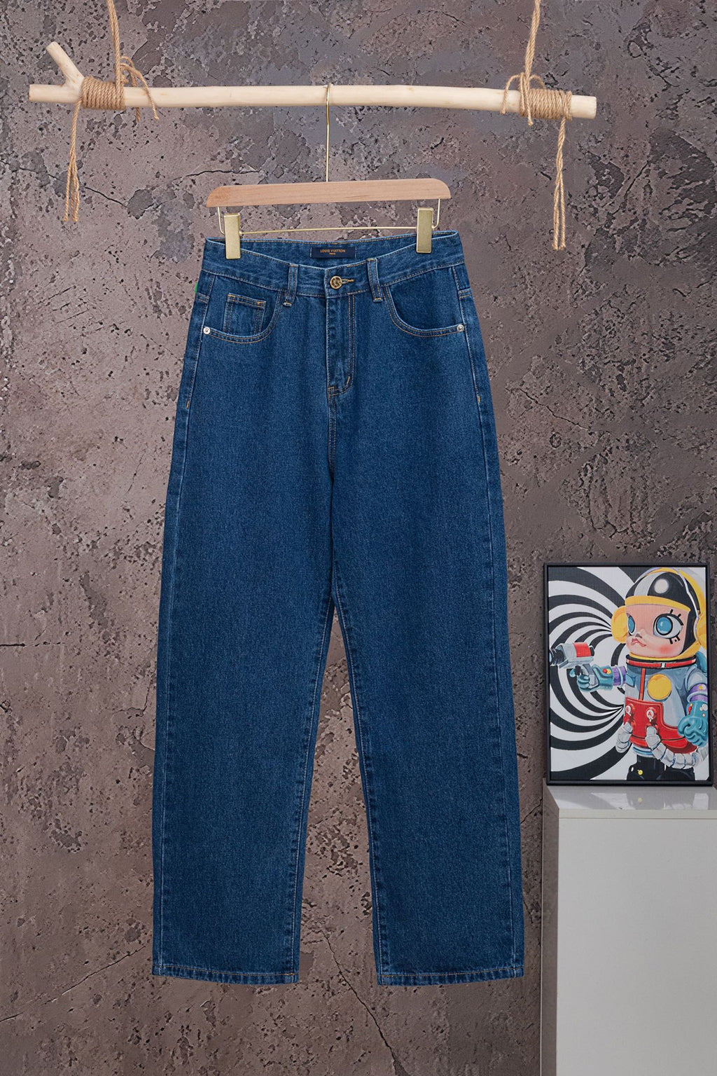 Blue denim jeans with button fly and belt loops
