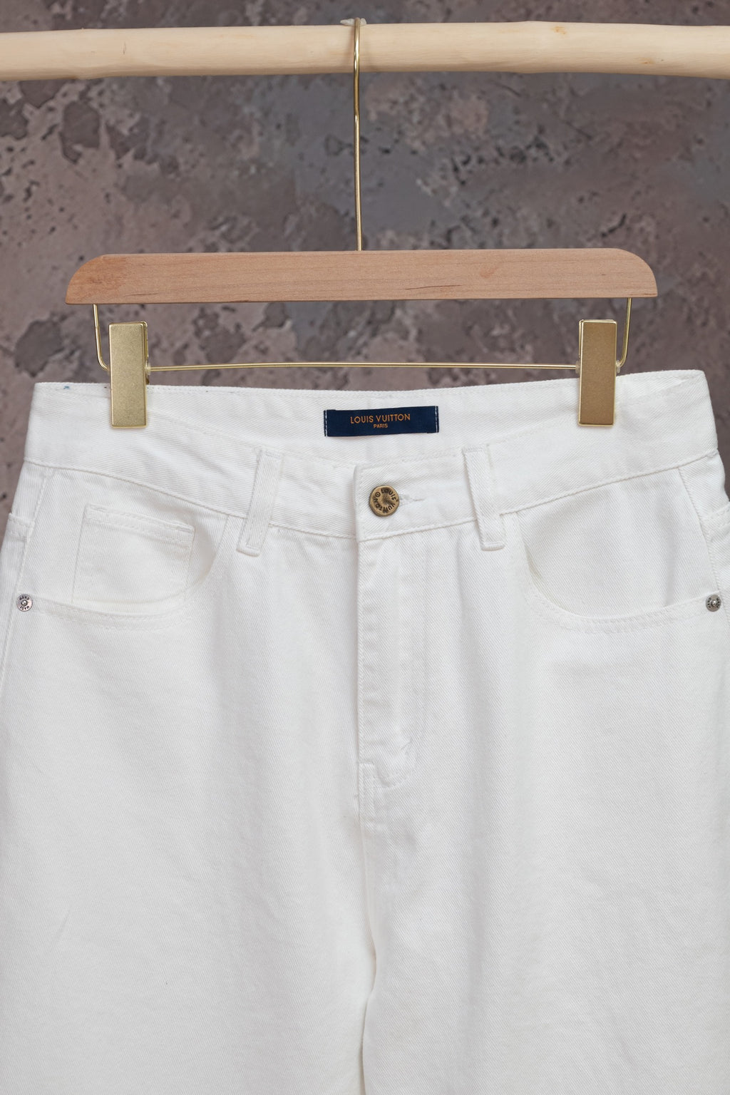 White Louis Vuitton pants front with belt loops, button fly and coin pocket