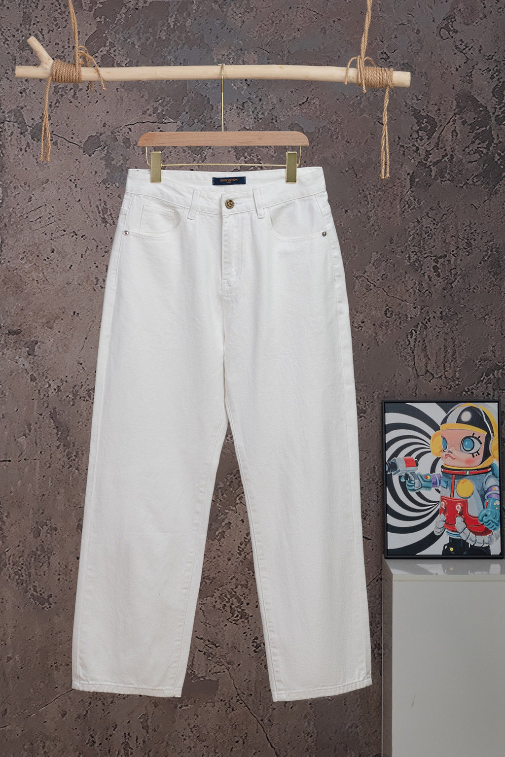 White Louis Vuitton pants on hanger, front button and belt loops