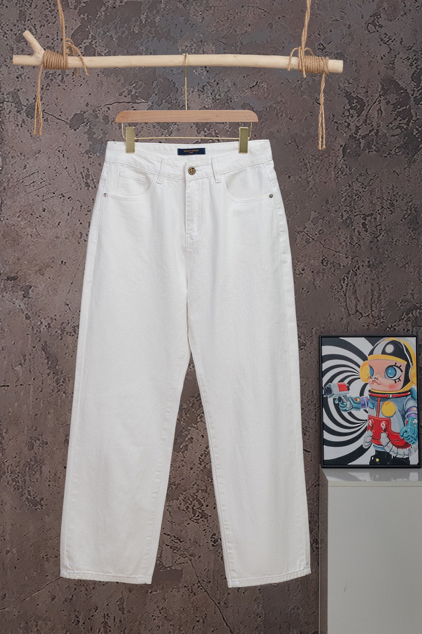 White Louis Vuitton pants on hanger, front button and belt loops