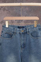 Light blue denim jeans with belt loops, front button, and dual front pockets
