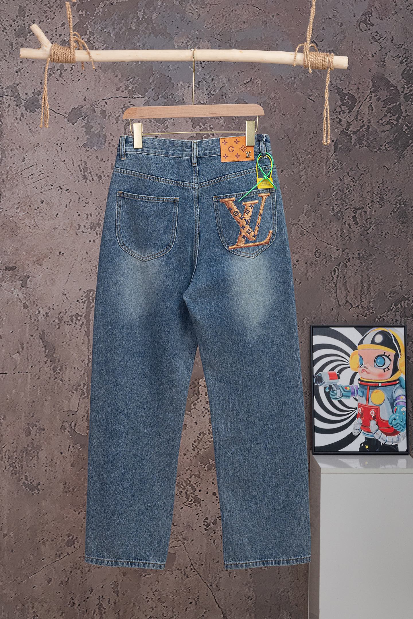 Light blue denim pants with front pockets and LV patch on back