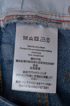 Louis Vuitton denim pants care label with washing icons and instructions