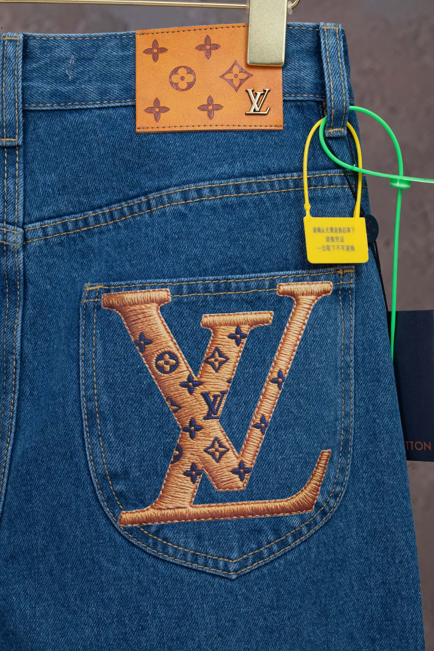 Louis Vuitton denim pants with large LV logo on back pocket