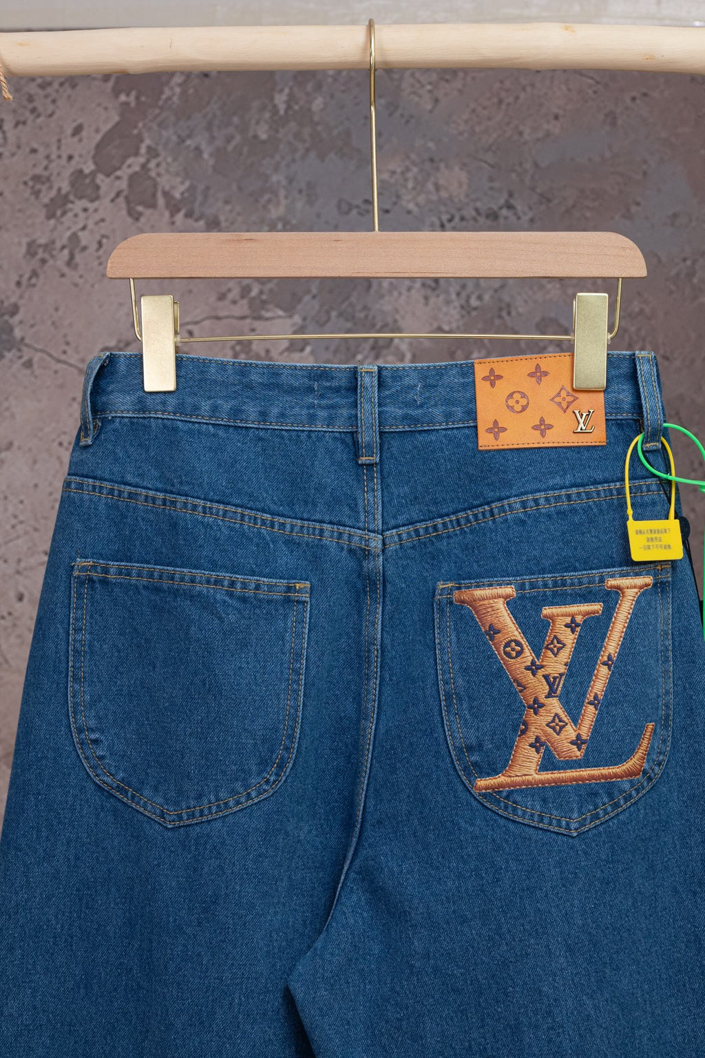 Louis Vuitton blue denim pants with back patch pocket and luggage-tag detail