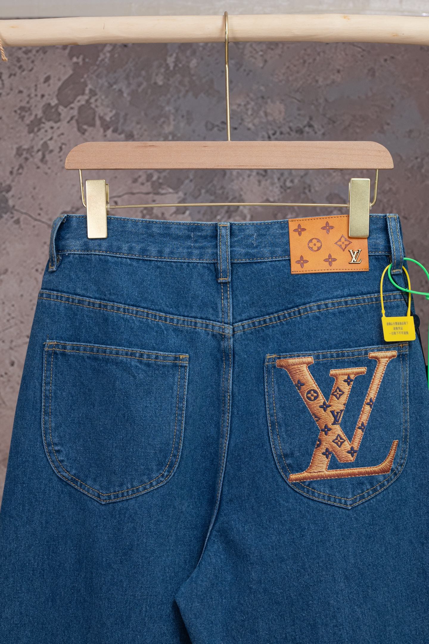 Louis Vuitton blue denim pants with back patch pocket and luggage-tag detail