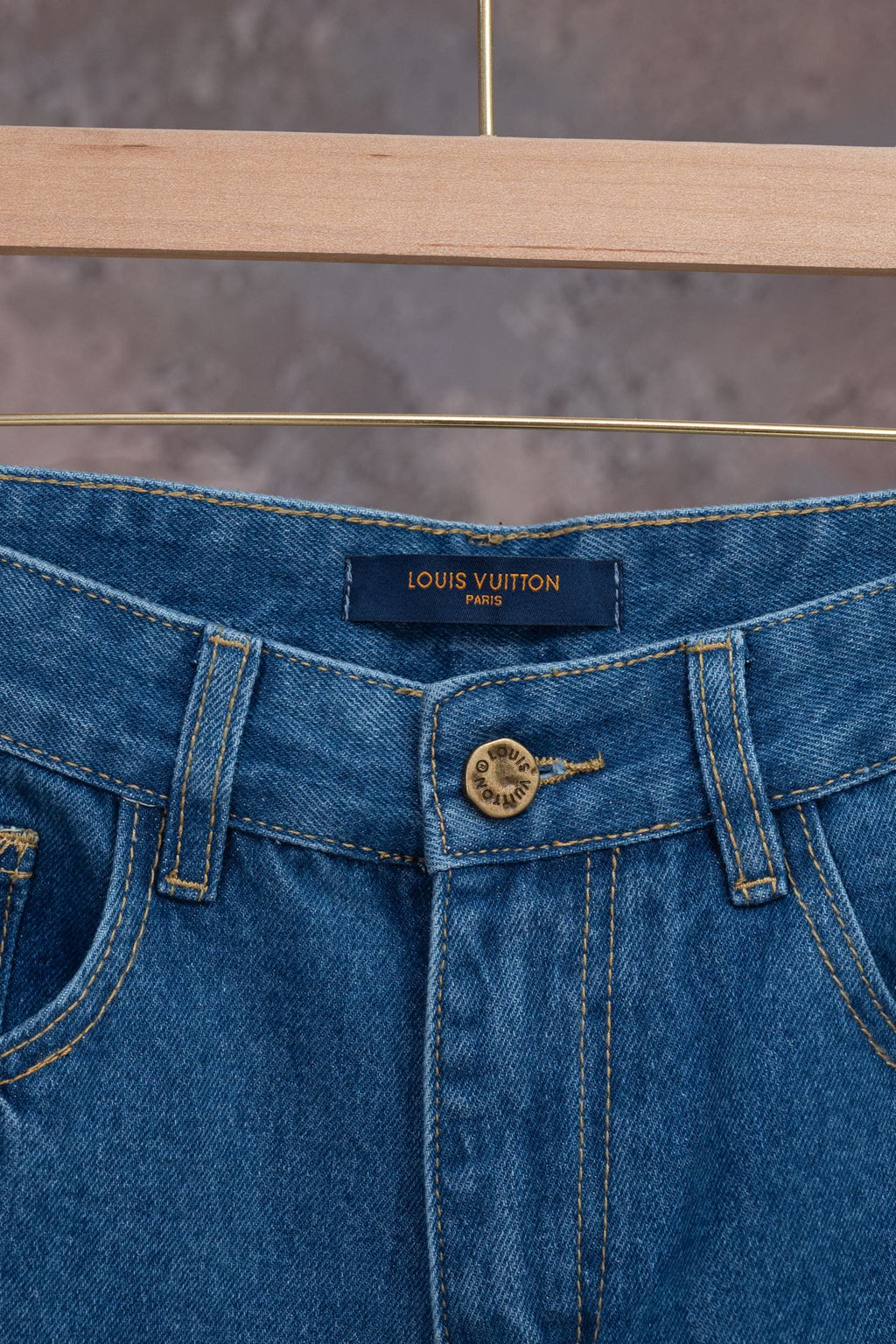 Louis Vuitton denim pants waistband with LOUIS VUITTON label and button