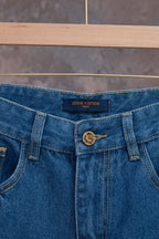 Louis Vuitton denim pants waistband with LOUIS VUITTON label and button