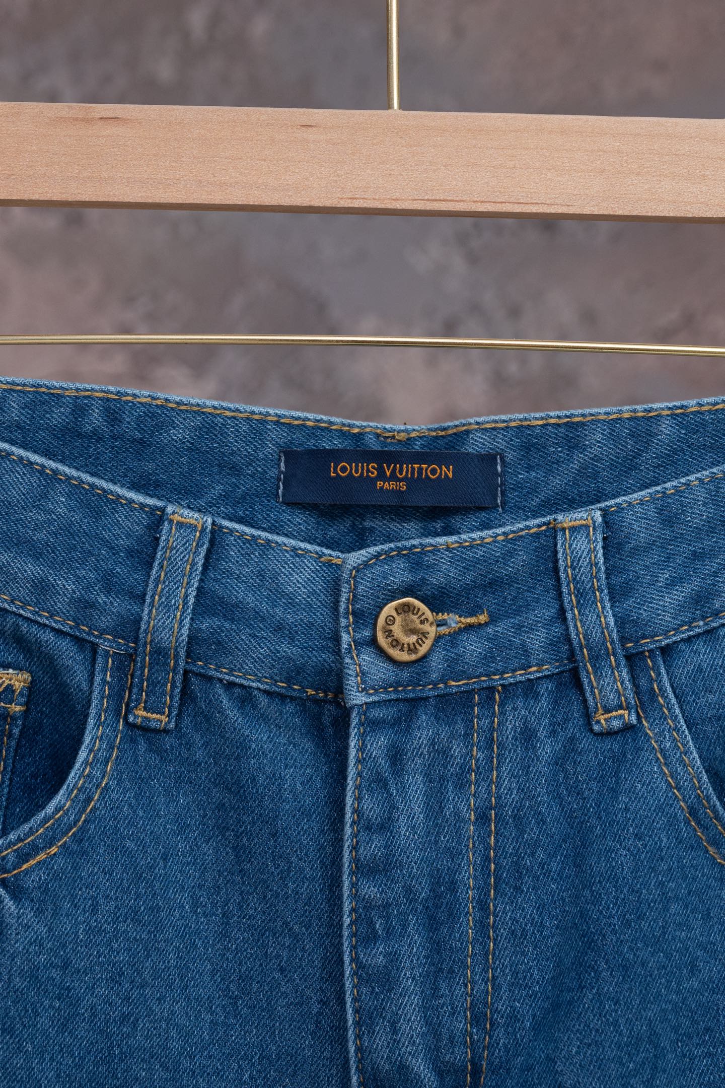 Louis Vuitton denim pants waistband with LOUIS VUITTON label and button