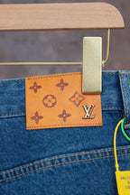 Louis Vuitton denim pants with tan monogram patch on back pocket