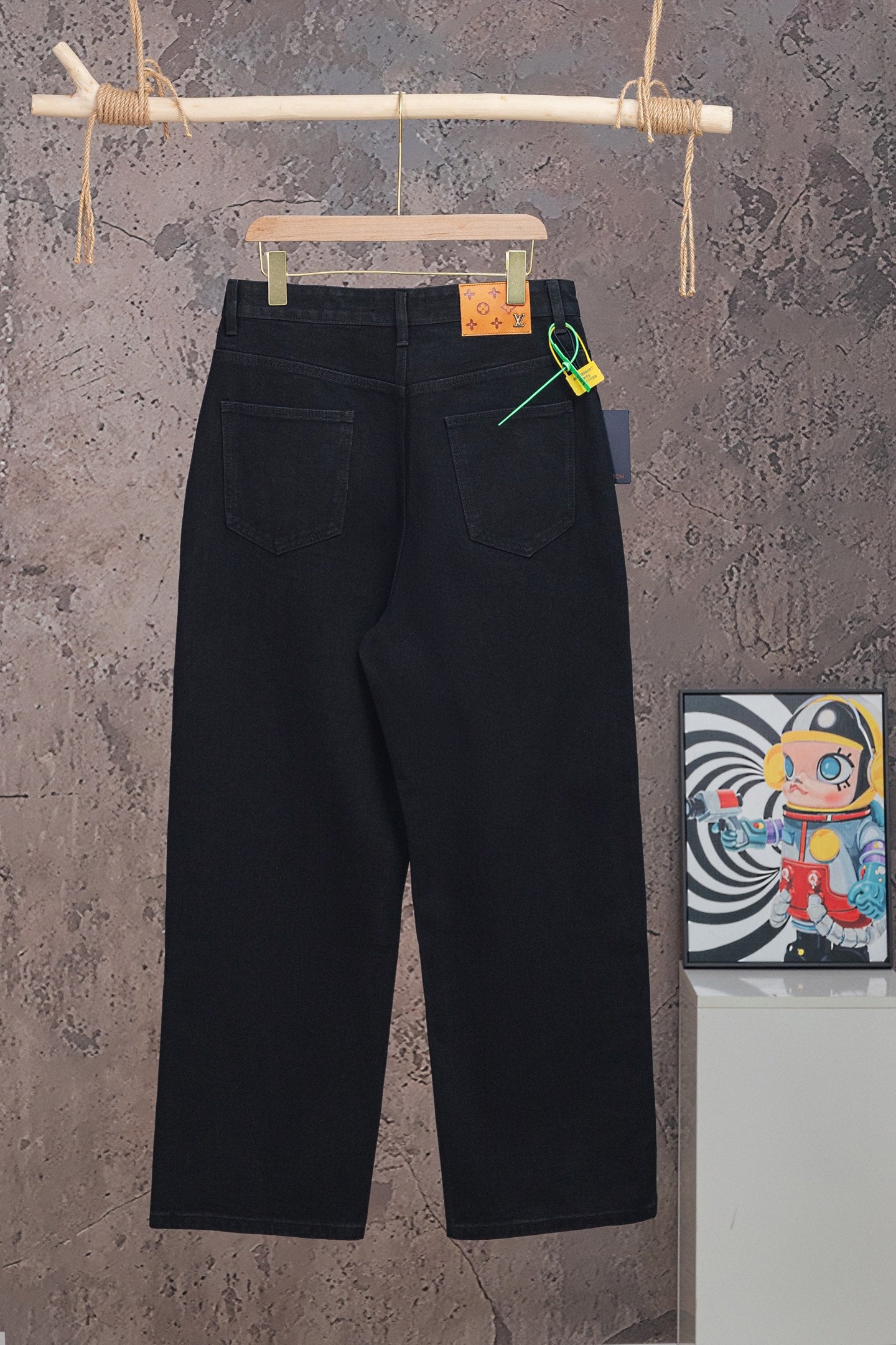 Black Louis Vuitton pants with straight legs and waistband logo patch