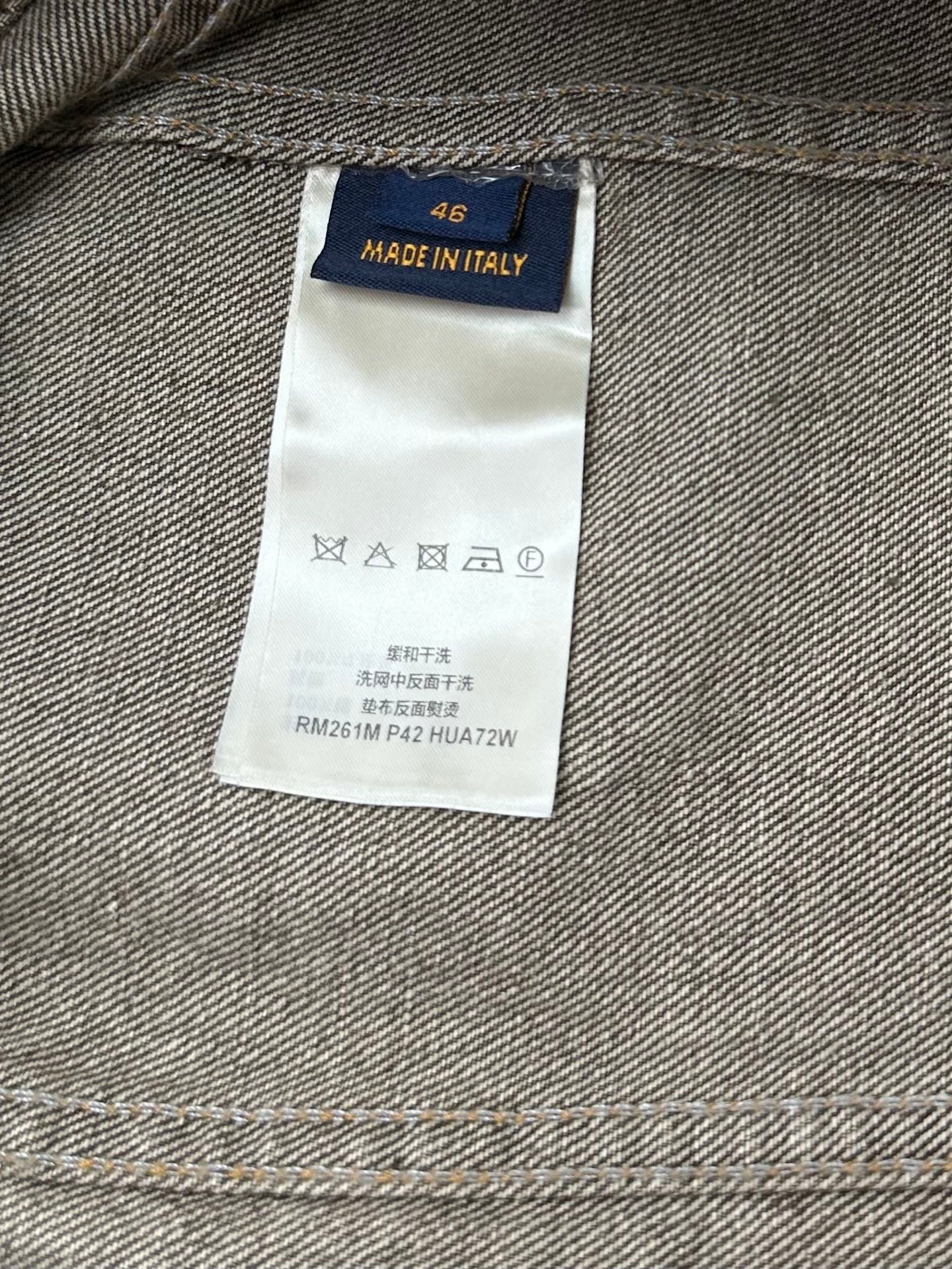 Denim jacket care label reading Made in Italy and RM261M P42 HUA72W