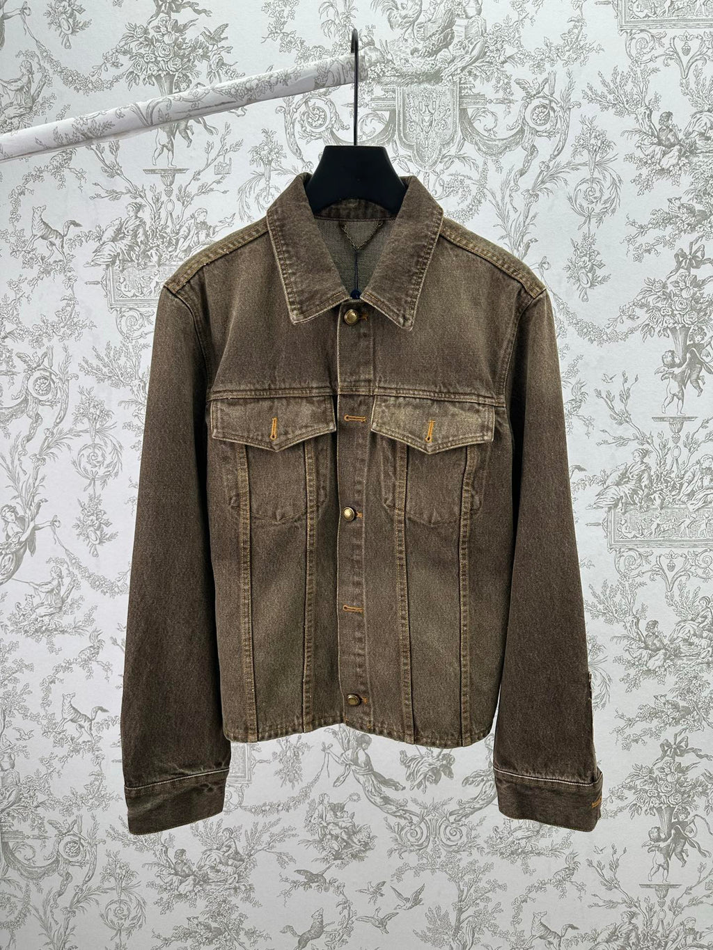 Dark gray denim jacket with button-up front and flap chest pockets, long sleeves