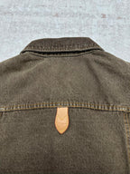 Dark gray denim jacket back with stand collar and tan leather brand patch
