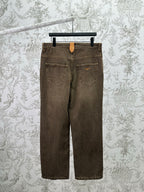 Brown denim jeans, back view with two patch pockets and belt loops