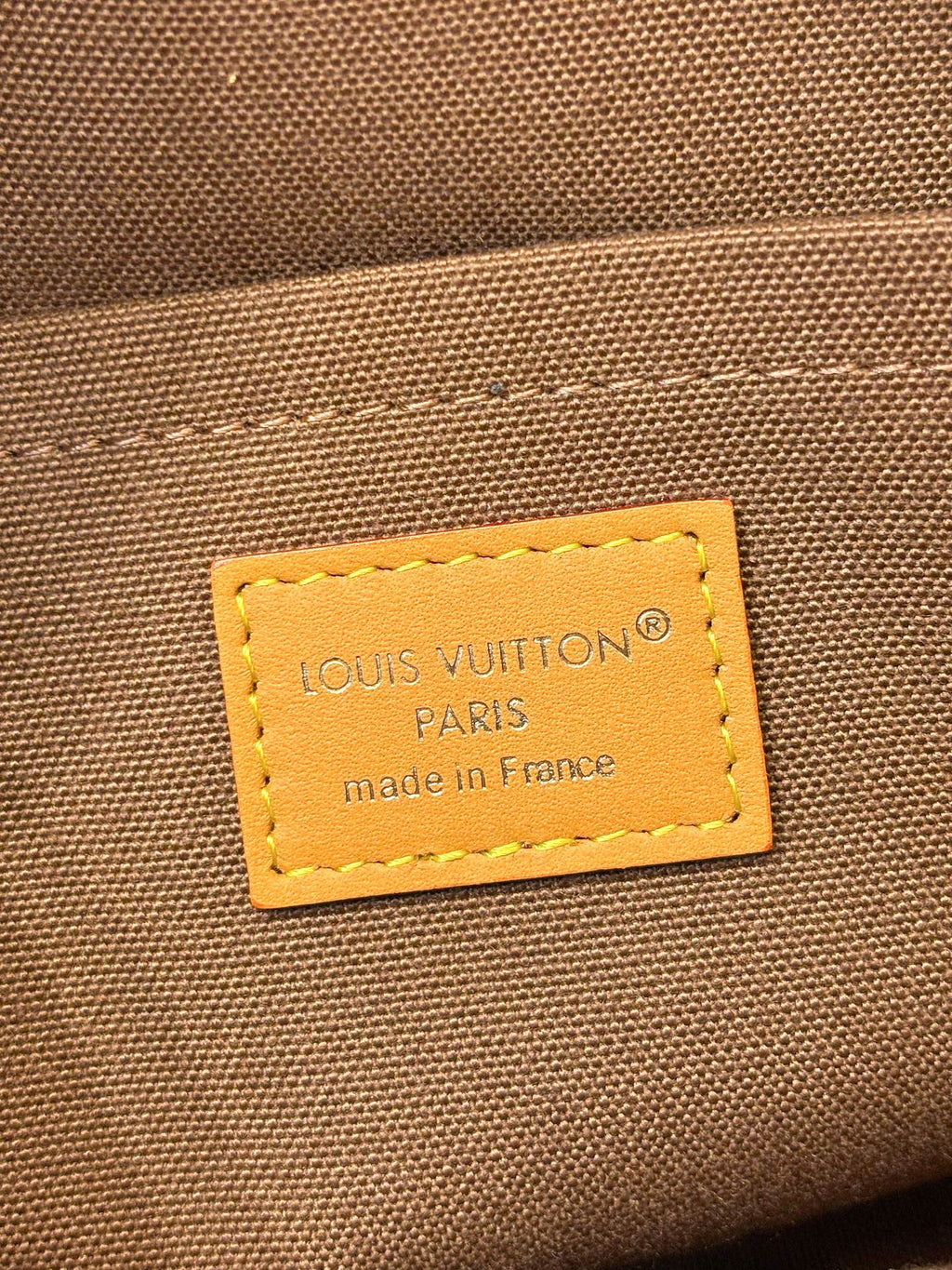 Louis Vuitton Paris label on monogram canvas bag, made in France