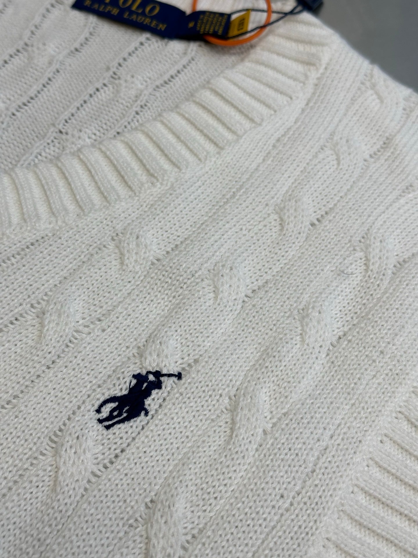 White cable-knit sweater vest with embroidered Polo logo at chest