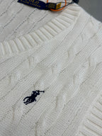White cable-knit sweater vest with small black polo horse logo on chest