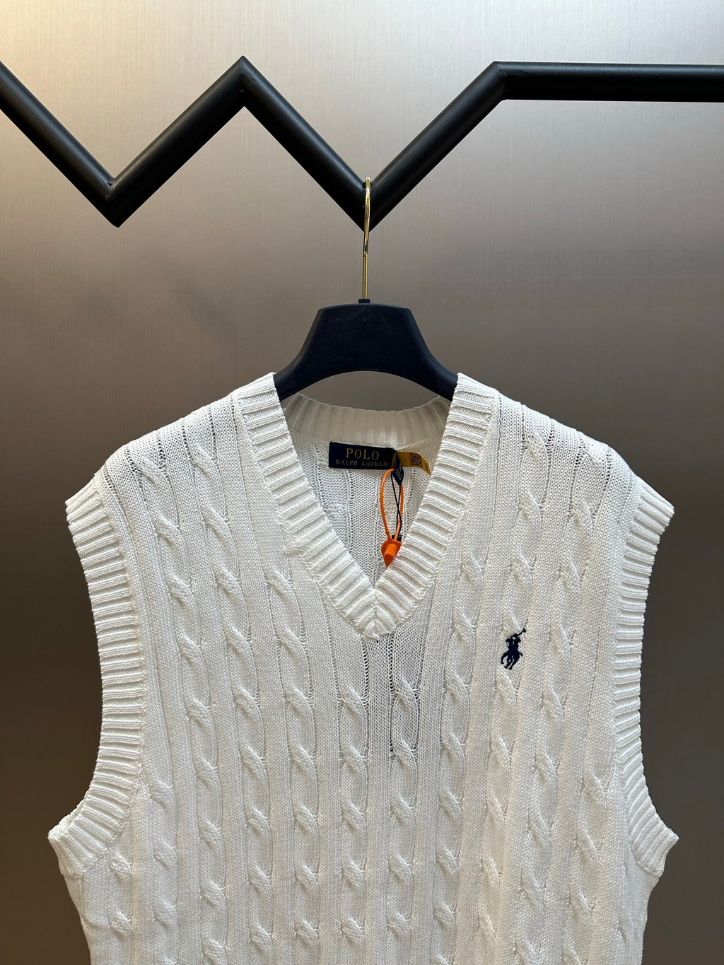 White V-neck cable-knit sweater vest with small Polo logo on chest