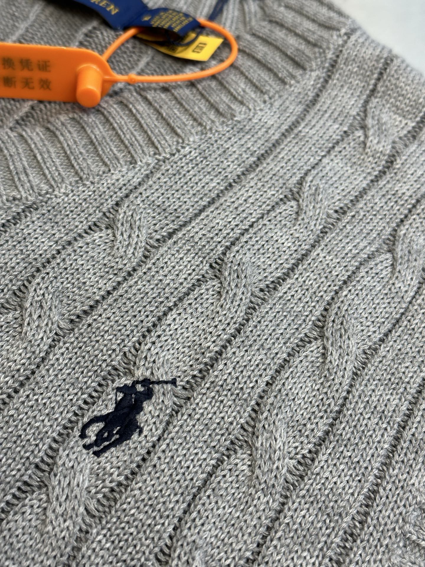 Gray cable-knit sweater vest with embroidered Polo horse at left chest