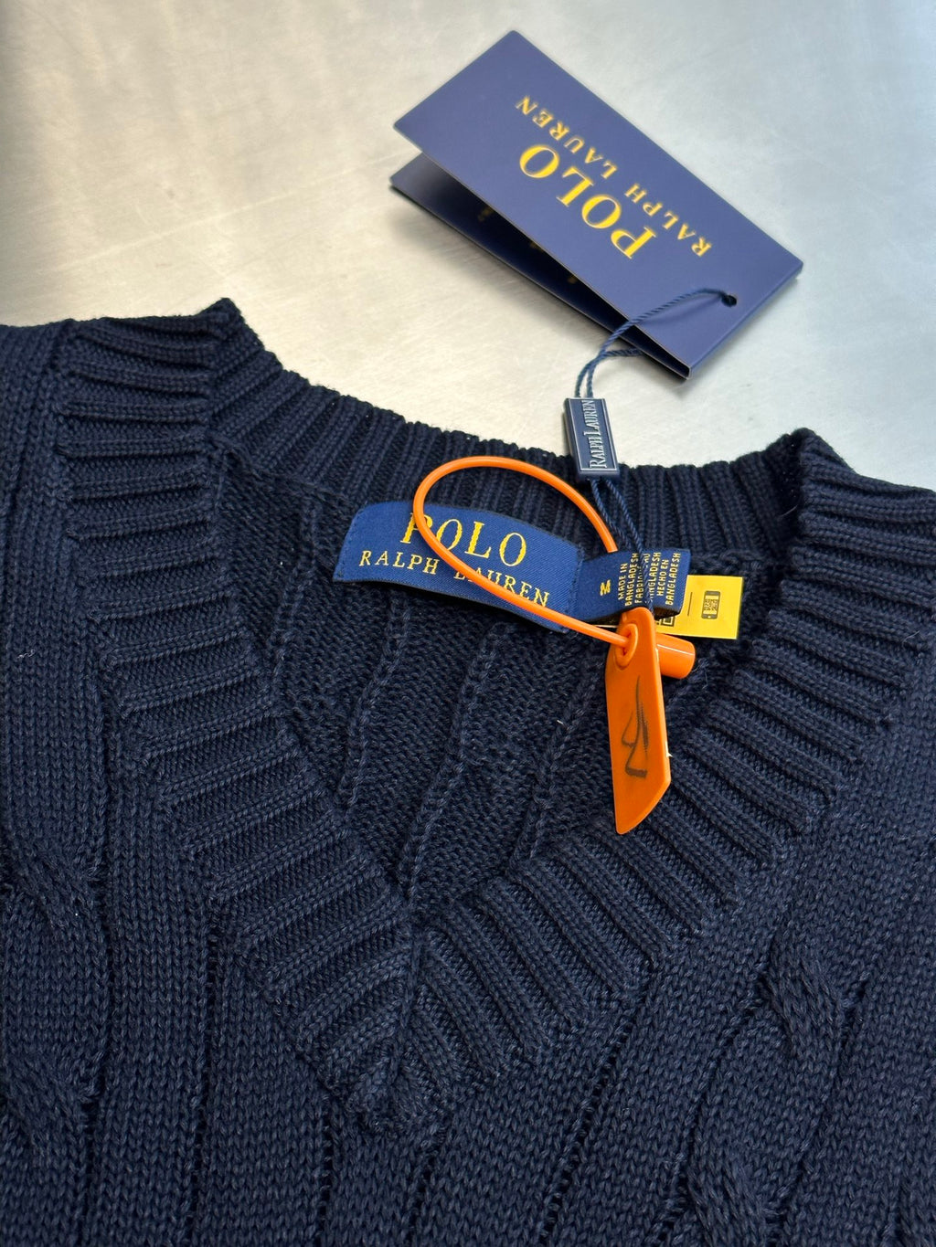 Navy V-neck sleeveless sweater vest with Polo label and red pony logo