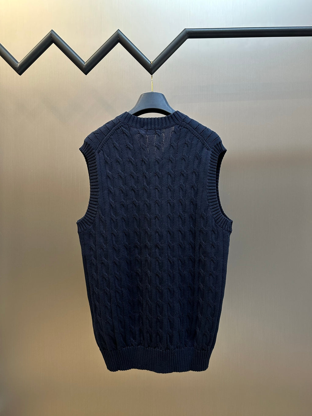 Navy knit sleeveless sweater vest with crewback and textured cable pattern